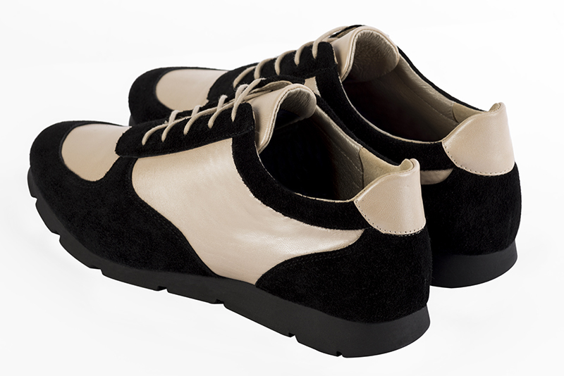 Matt black and gold women's two-tone elegant sneakers. Round toe. Flat rubber soles. Rear view - Florence KOOIJMAN